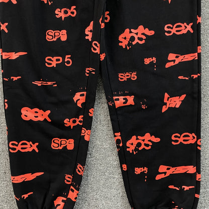 SP5DER SEX AOP SWEATPANTS BLACK